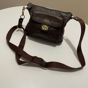 COACH brown leather crossbody with adjustable cloth strap and zip closure